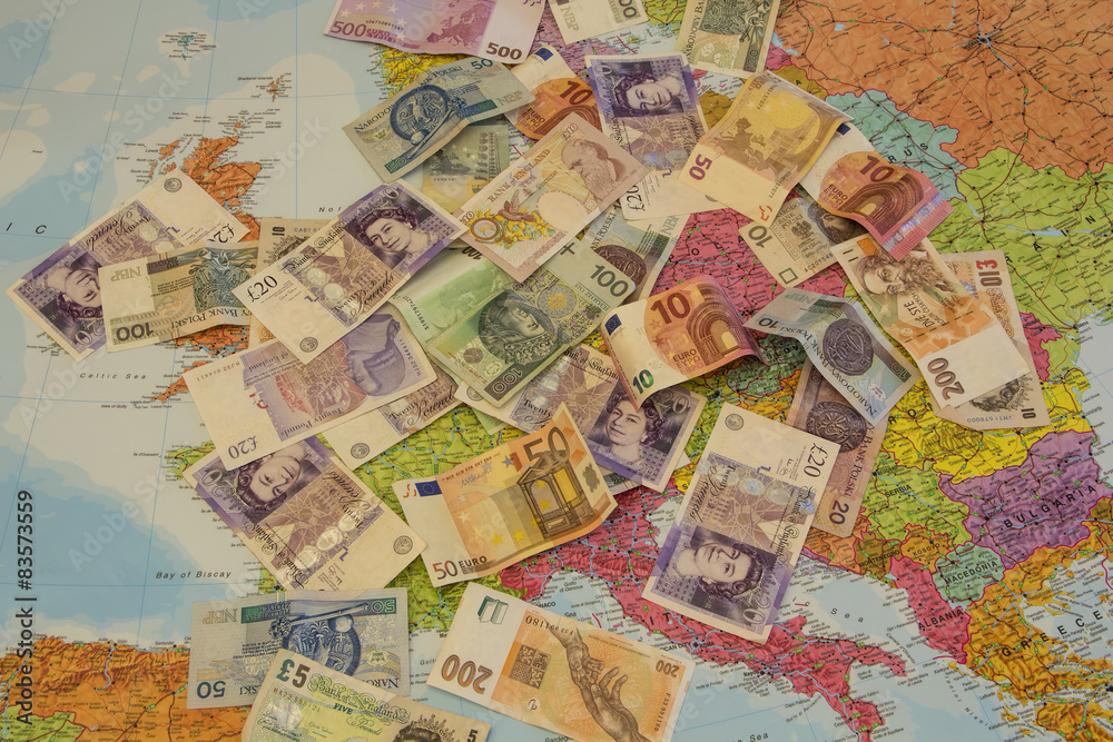 Four different currencies laid out on the map of Europe