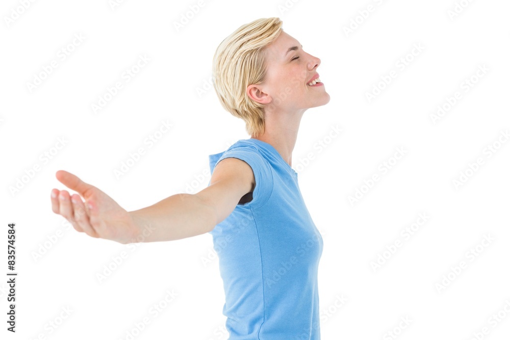 Blonde woman standing arms outstretched Blonde woman standing arms outstretched