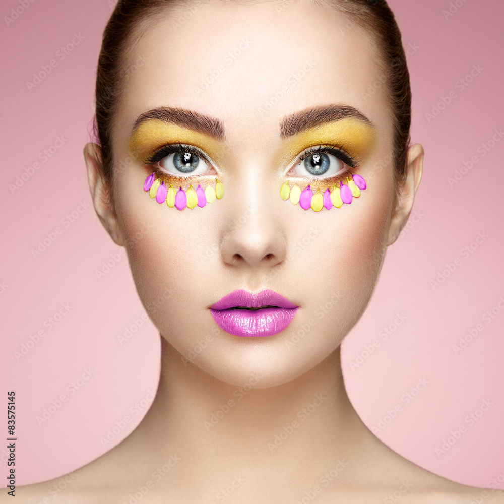 Face of beautiful woman decorated with flowers Face of beautiful woman decorated with flowers