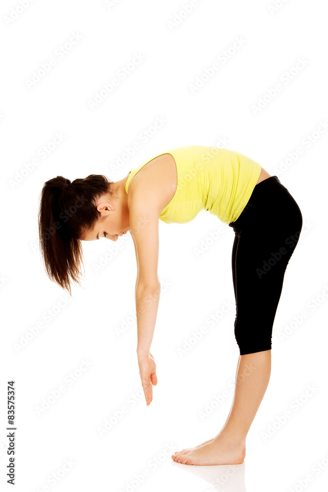 Fototapeta premium Fitness woman doing stretching exercise.