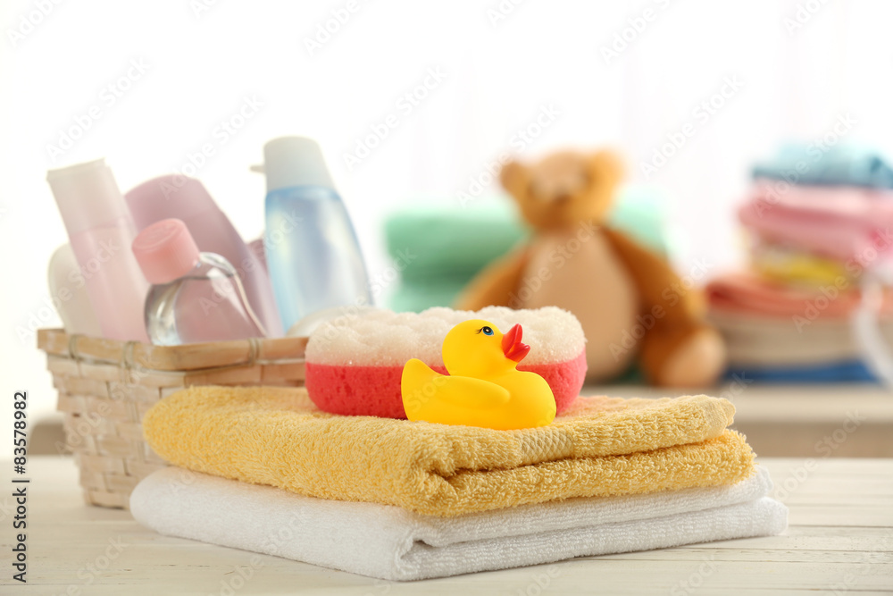 Baby accessories for bathing on table on light background Baby accessories for bathing on table on light background