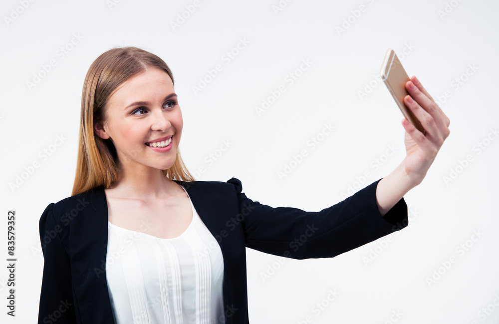 Businesswoman making selfie photo on smartphone Businesswoman making selfie photo on smartphone