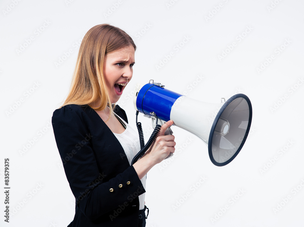 Young businesswoman screaming in megaphone Young businesswoman screaming in megaphone