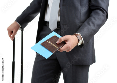 Man holding suitcase isolated on white