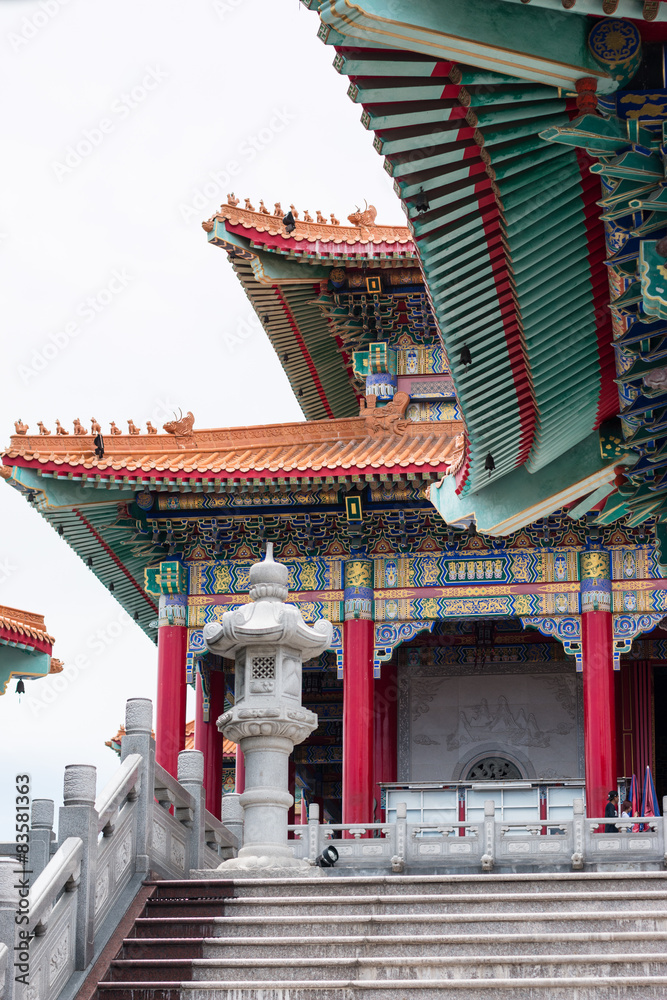 Fototapeta premium Colorful Buddhist Chinese temple in Thailand with blue sky .