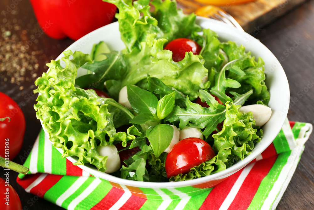 fresh vegetable salad in bowl on table close up fresh vegetable salad in bowl on table close up