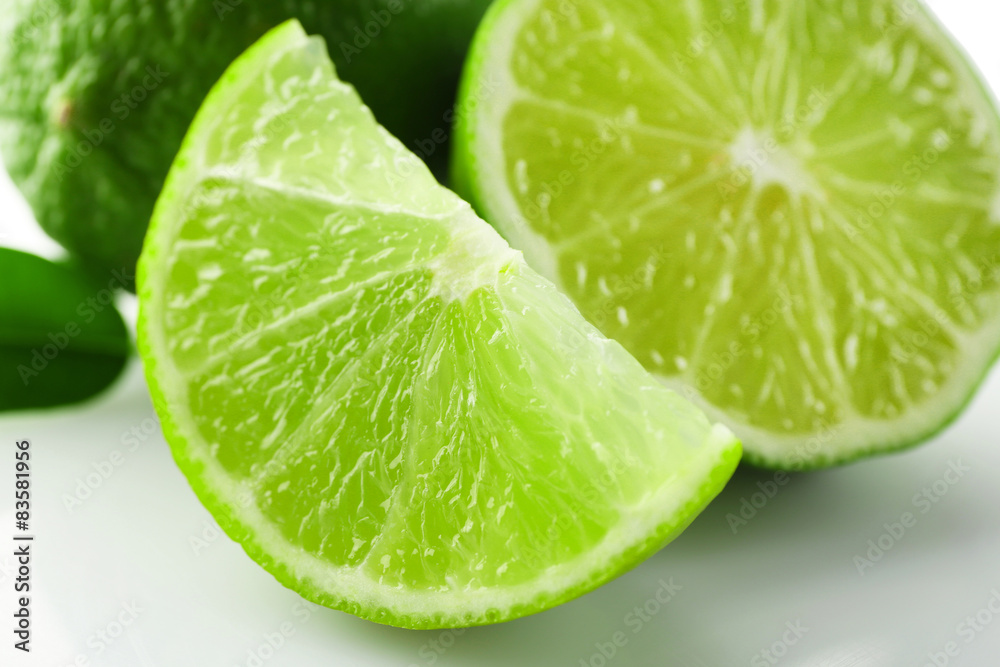 Sliced fresh limes, closeup Sliced fresh limes, closeup