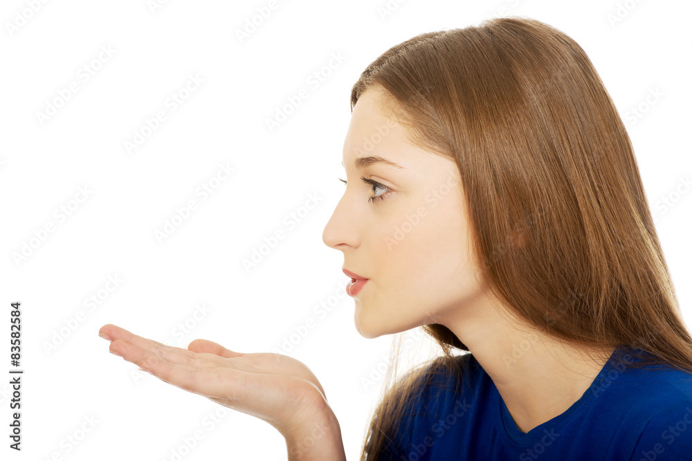 Beautiful young woman blowing a kiss. Beautiful young woman blowing a kiss.