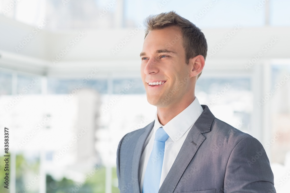 Smiling businessman looking away Smiling businessman looking away