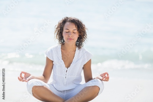 happy woman doing yoga beside the sea  © WavebreakmediaMicro