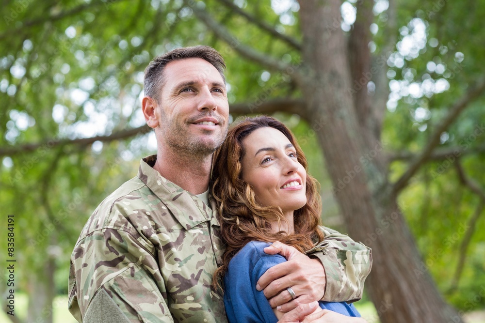 Fototapeta premium Handsome soldier reunited with partner