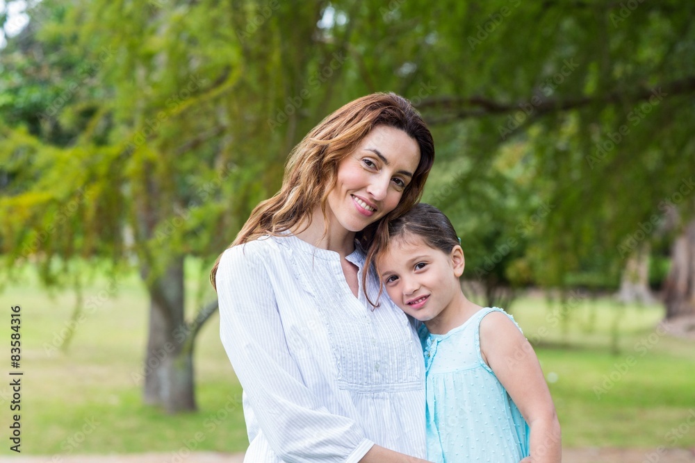 mother and daughter smiling at the camera mother and daughter smiling at the camera