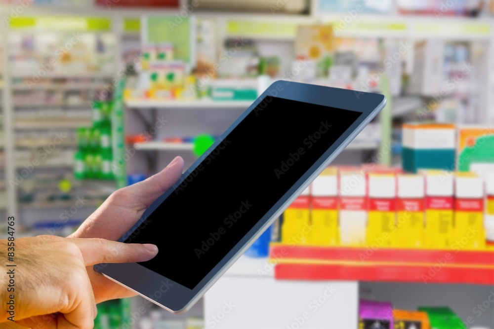 Composite image of man using tablet pc Composite image of man using tablet pc