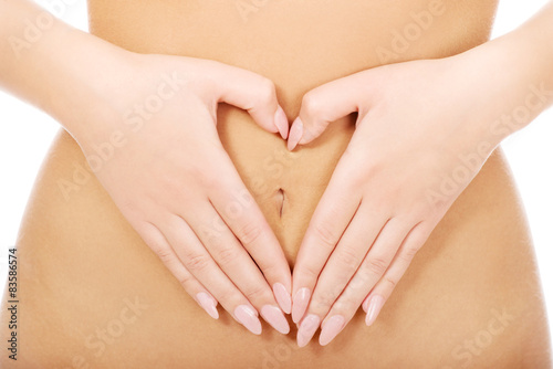 Woman with her hands on belly.