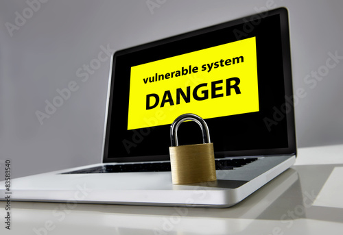 Photography lock on computer laptop keayboard with warning message danger