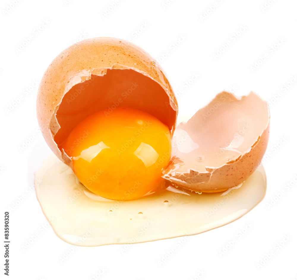 closeup of raw broken egg isolated on white closeup of raw broken egg isolated on white
