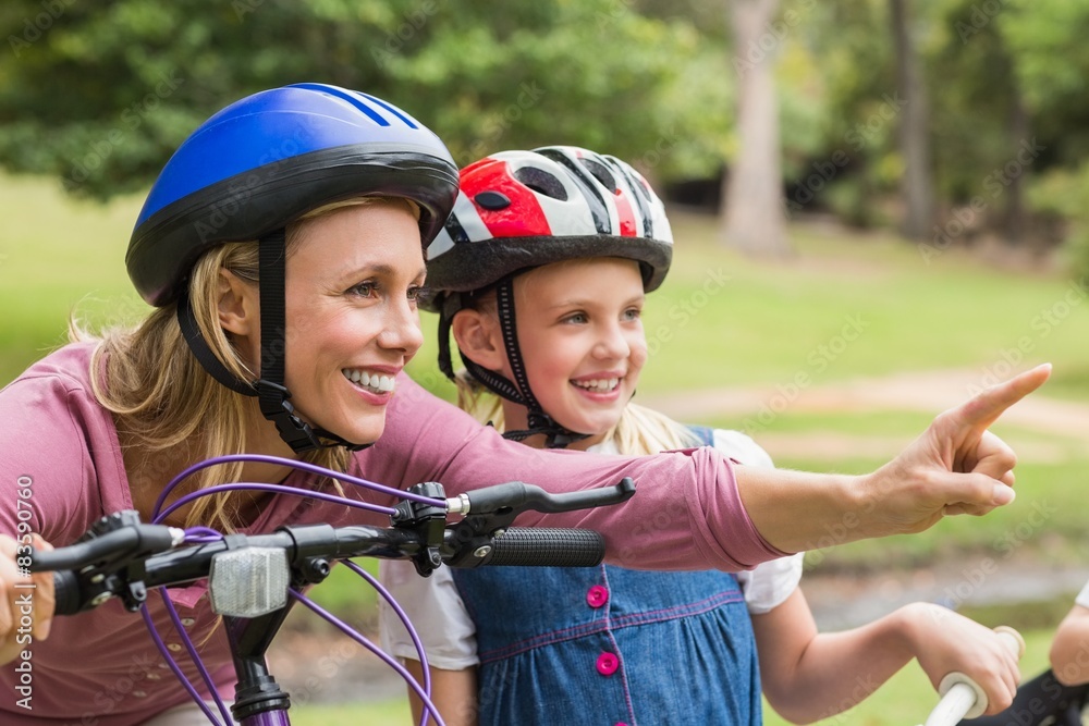 Mother and her daughter on their bike Mother and her daughter on their bike