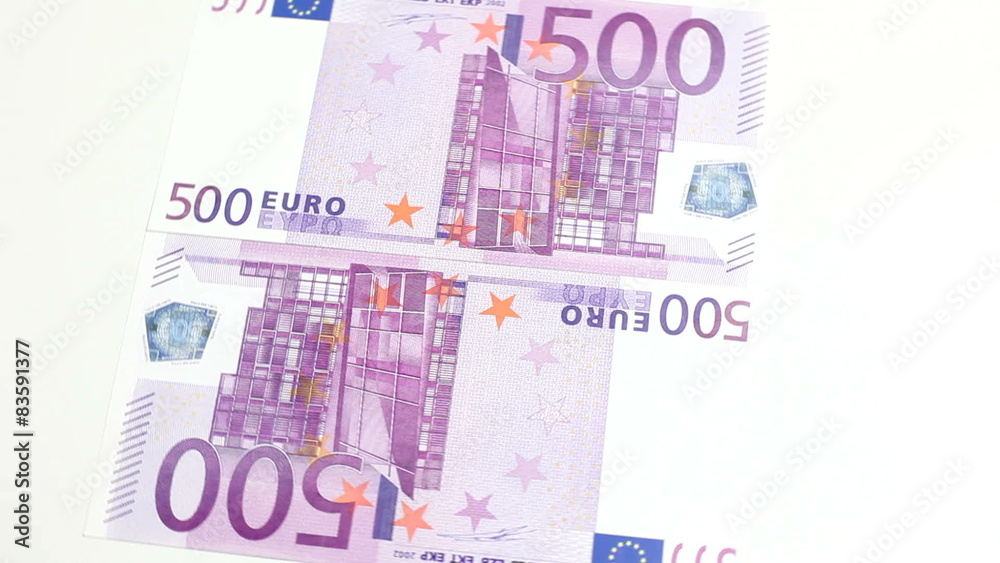 Two 500 euro notes rotating on white background Two 500 euro notes rotating on white background