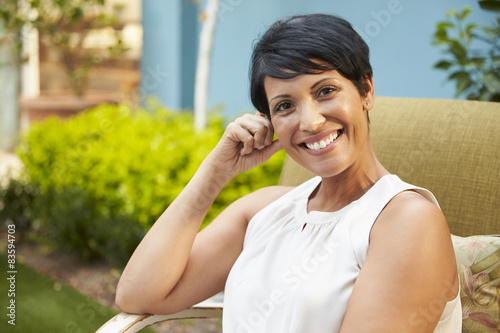 Εκτύπωση καμβά Portrait Of Mature Woman Relaxing Outdoors In Garden