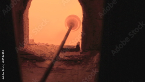 Pulling A Piece Of Molten Glass Out Of A Molten Glass Mass 

