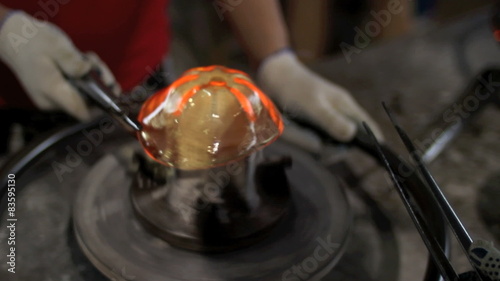 Using A Rotating Shape For Molten Glass
