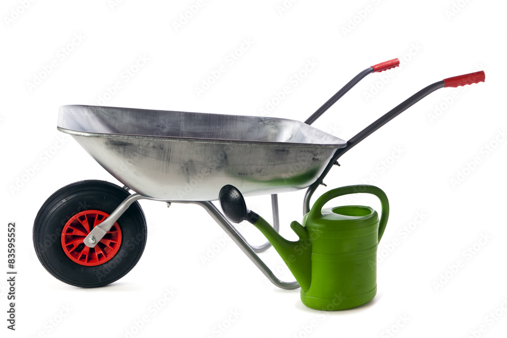 Wheelbarrow and watering can isolated Wheelbarrow and watering can isolated