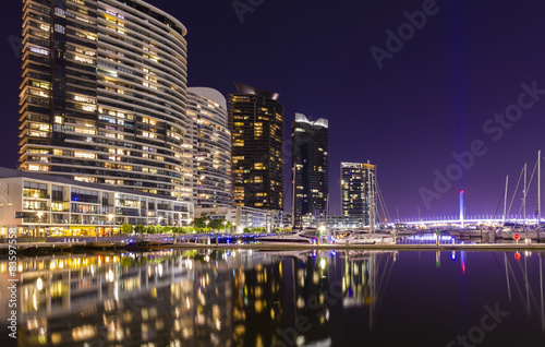 Modern apartments in Docklands, Melbourne at night © sunflowerey