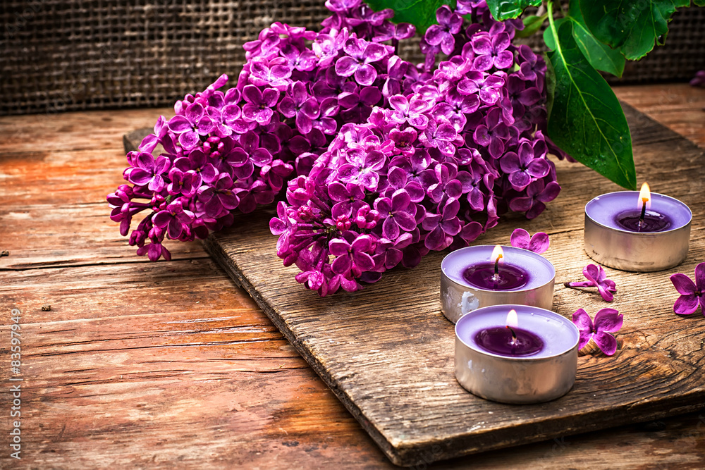 Bush may lilac and lighted candle Bush may lilac and lighted candle
