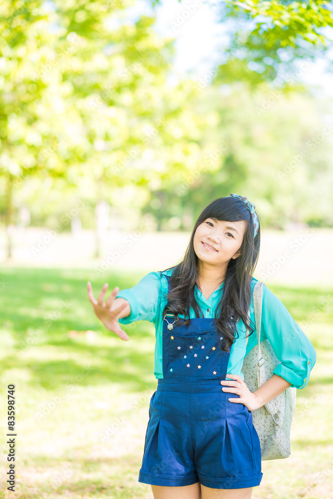 Asian woman smiling happy on sunny summer day. Asian woman smiling happy on sunny summer day.
