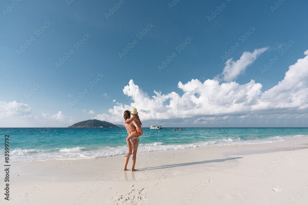 Mother with child on a beach