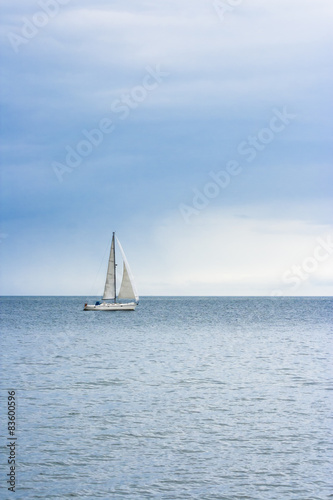 Sailing boat at an open sea © Niciak