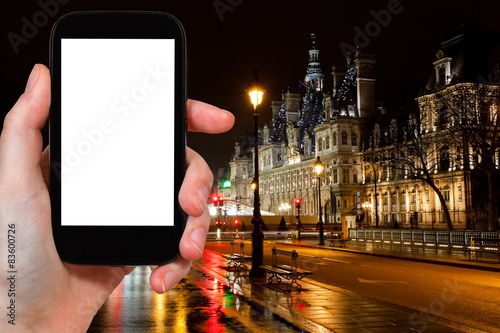 tourist photographs of City Hall in Paris at night photo