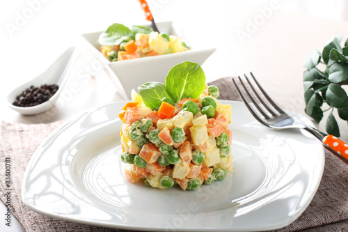 Russian salad with peas, carrots, potatoes and mayonnaise
