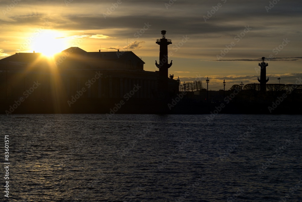 Rostral columns silhouette in sunset light, Saint-Petersburg