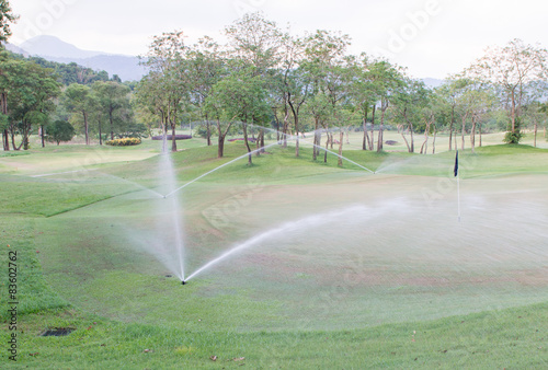 sprinkler water in golf course.