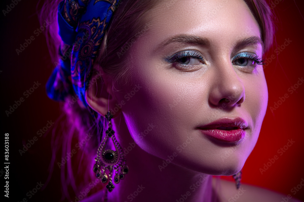 Obraz premium Beauty portert beautiful model in a bright scarf on her head