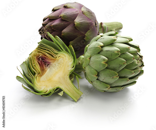whole and half cut artichoke isolated on white background