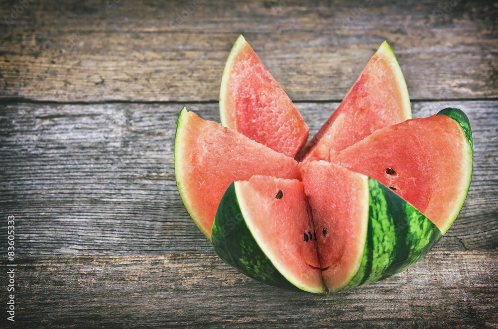 Fresh watermelon on rustic wooden table Fresh watermelon on rustic wooden table