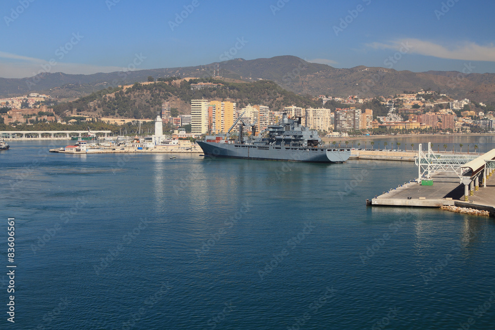 Mediterranean port city and military ship. Malaga, Spain