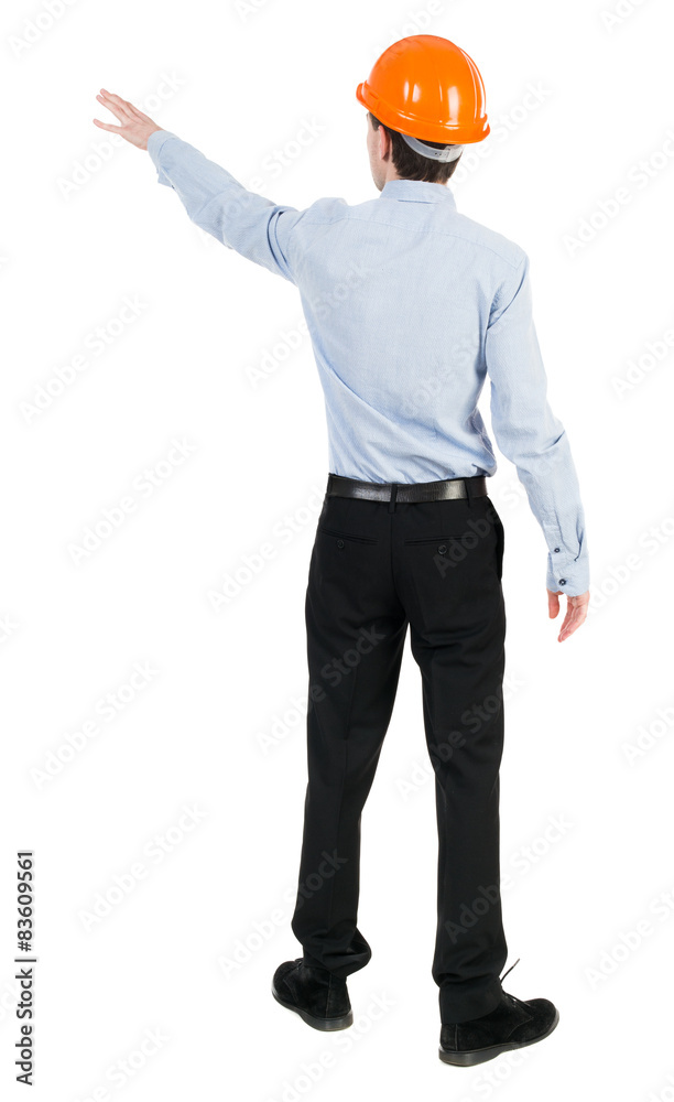 Back view of pointing young men in shirt and helmet. Back view of pointing young men in shirt and helmet.