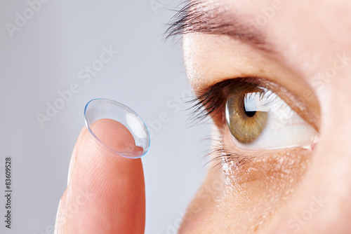 Fototapeta Naklejka Na Ścianę i Meble -  Young womans eye and contact lens