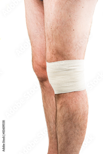 man with elastic bandage on knee
