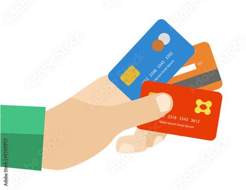 hand holding credit cards to pay