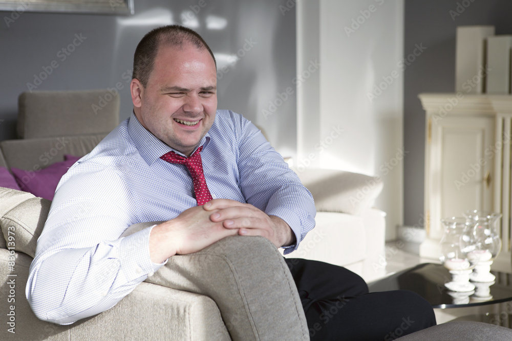 businessman sitting on couch businessman sitting on couch