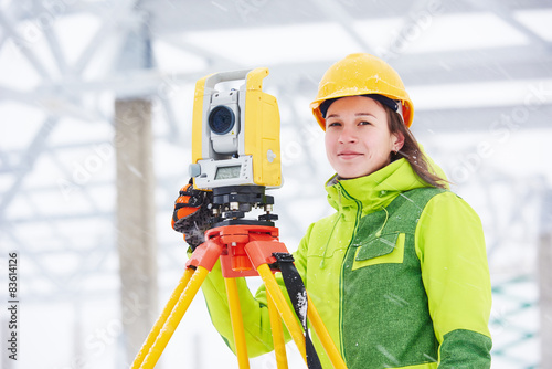 surveyor works with theodolite