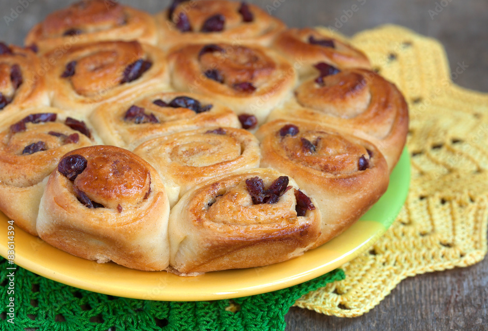 Traditional English buns Chelsea with dried cranberries