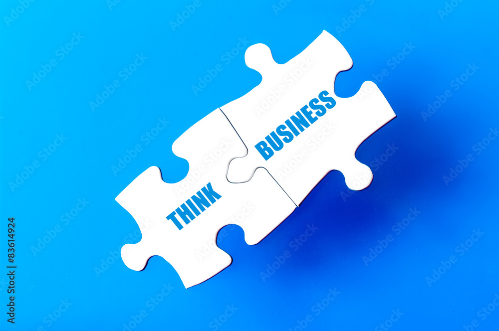 Connected puzzle pieces with text THINK BUSINESS Connected puzzle pieces with text THINK BUSINESS