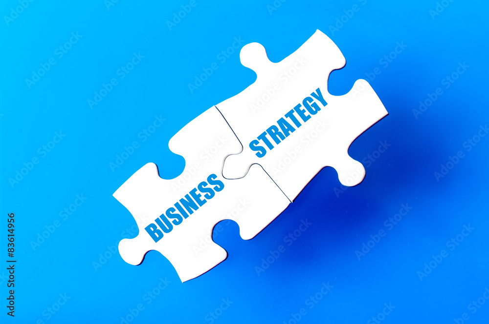 Connected puzzle pieces with words BUSINESS and STRATEGY Connected puzzle pieces with words BUSINESS and STRATEGY