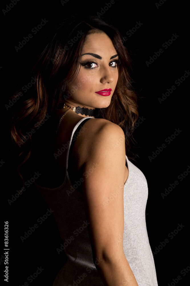 woman in gray sleeveless dress on black side serious woman in gray sleeveless dress on black side serious