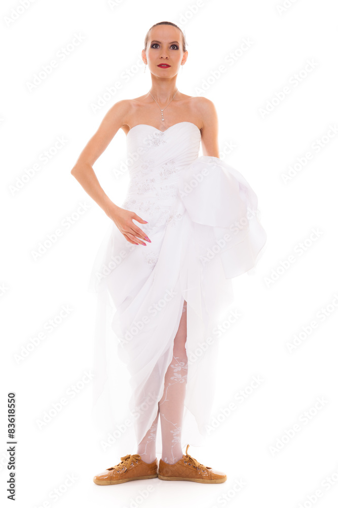 Fototapeta premium Wedding. Running bride funny woman in sport shoes